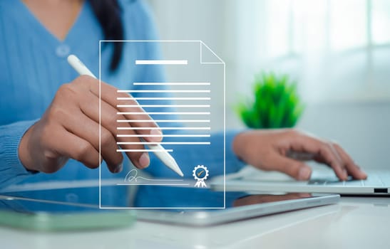 Businesswoman use electronic pen sign signature on electronic E-signing, Data sheet document management, Electronic signature and paperless office concept.