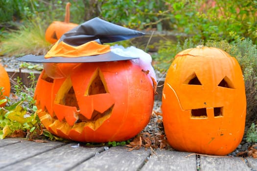 Halloween pumpkins. Decorated pumpkins ready for Halloween. Outdoor decorations for Halloween.