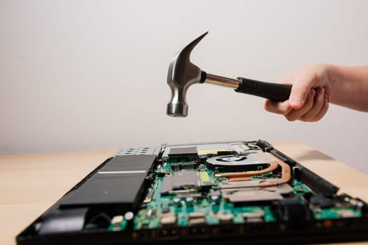 Prague, Czechia - 7th May 2022 Service engineer install a new chips to laptop. Repairing laptop.