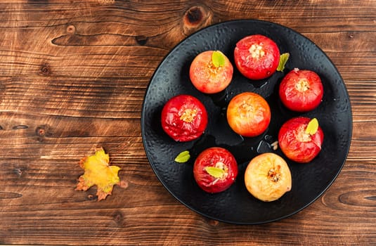 Tasty baked apple dessert with and nuts.