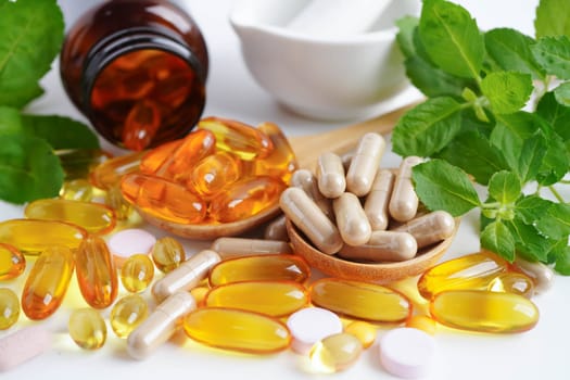 Alternative medicine herbal organic capsule with vitamin E omega 3 fish oil, mineral, drug with herbs leaf natural supplements for healthy good life.