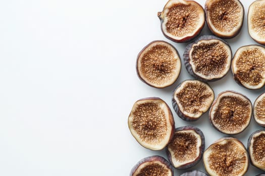 A collection of dried figs laid out on a pristine white surface highlights their rich texture and unique patterns, emphasizing their natural sweetness and health benefits.