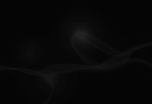 Graceful, swirling curves emerging from a dark backdrop, emphasizing fluidity and a dynamic sense of movement, inviting contemplation. Black background with smooth lines. Generative AI.