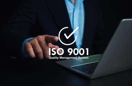 ISO 9001 Standard certification standardisation quality control concept. Businessman point your finger at text ISO 9001 for quality management of organizations, Certified and quality.
