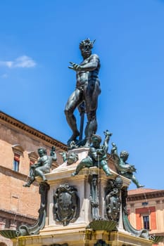 Bologna, Italy - 10 June 2024, the famous Neptune fountain located in Neptune Square. Bronze sculpture, blue sky