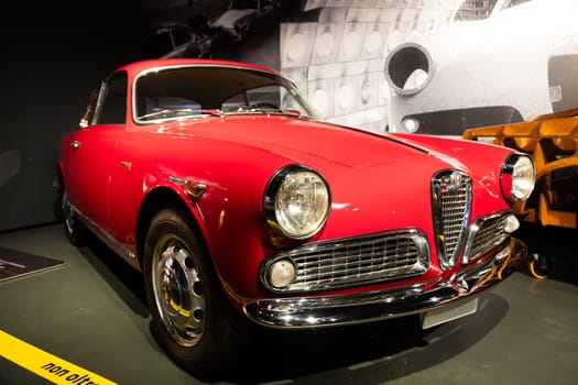 Turin, Italy - 11 november 2023: Car Museum. Alfa Romeo Giulietta Sprint, 1954. Red spider, Italian luxury classic design.