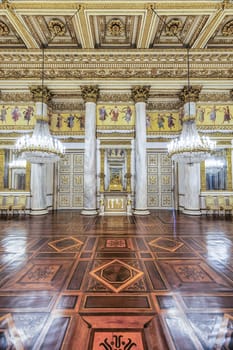 Turin, Italy - 17 november 2023: baroque ballroom interior in Royal Palace, 1842. Luxury marble, antique chandelier, classic floor