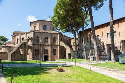 RAVENNA, ITALY - JUNE 12, 2024: San Vitale Basilica, famous for the ancient mosaics, exterior with blue sky