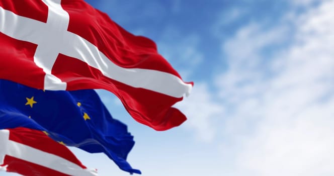National flags of Denmark and of the European Union waving in the wind. 3D rendered illustration. Selective focus. Fluttering fabric. EU membership