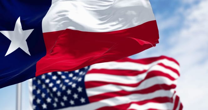 Texas state flags waving in the wind with american flag. Blue vertical stripe with white star, white and red horizontal stripes. 3D illustration render. Fluttering fabric background. Selective focus