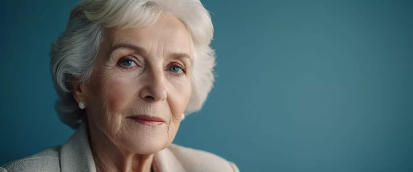 Sophisticated older French woman sits contemplatively in a softly lit room. Demeanor reveals a lifetime of experiences and reflections, embodying grace and wisdom. Well-groomed woman 70 years old. AI.