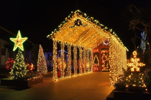 Shimmering lights and decorations adorn an outdoor pavilion creating a festive atmosphere for the holiday season at night.