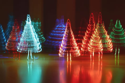 Festive trees glow in vibrant colors creating a cheerful atmosphere for the holiday season with their unique light patterns.