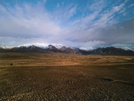 Desert steppe by the Andes mountains near Uspallata, Argentina. Aerial view.