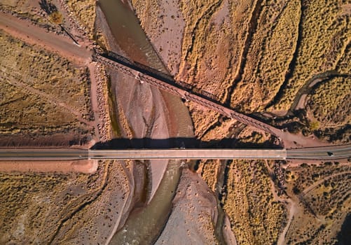 Bridge across Mendoza River by the Andes mountains near Uspallata, Argentina. Aerial view.