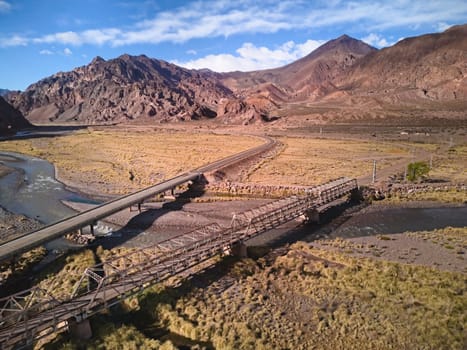 Bridge across Mendoza River by the Andes mountains near Uspallata, Argentina.