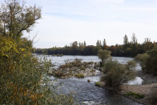 Autumn atmosphere at the Isteiner Schwellen on the Rhine near Efringen-Kirchen (Lörrach district). In bright sunshine,numerous excursionists from Germany and abroad took advantage of the beautiful late summer weather on Sunday to take a trip to the Rhine.