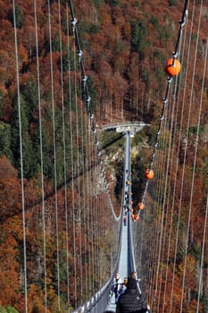 In wonderful late summer weather,visitors were offered a magnificent view and a touch of Indian summer feeling on Sunday during an autumn walk over the 450-metre-long Blackforestline suspension bridge in Todtnau/Todtnauberg (Lörrach district),120 metres above the ground
