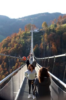 In wonderful late summer weather,visitors were offered a magnificent view and a touch of Indian summer feeling on Sunday during an autumn walk over the 450-metre-long Blackforestline suspension bridge in Todtnau/Todtnauberg (Lörrach district),120 metres above the ground