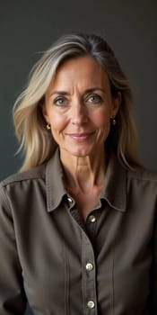 A French Caucasian woman 50 - 60 years old with loose hair and a warm smile stands in her home, radiating tranquility and confidence while dressed casually. Generative AI.