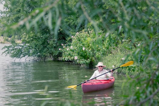 Woman is kayaking on a small lake in Central Kentucky