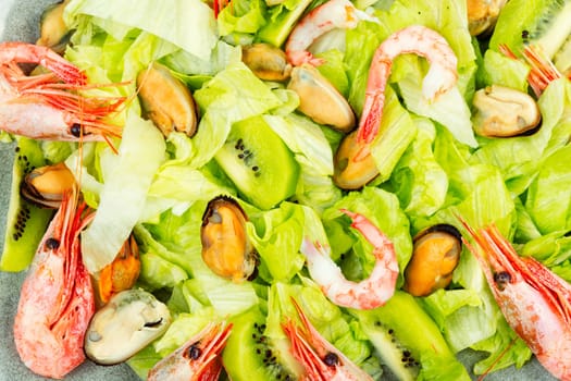 Homemade seafood salad with mussels and shrimps. Food background