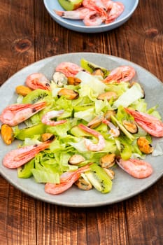 Homemade seafood salad with mussels and shrimps. Food background