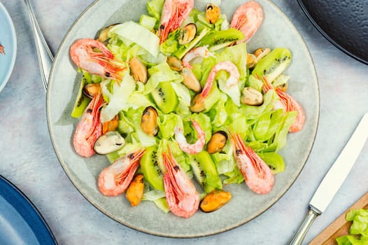 Homemade seafood salad with mussels and shrimps. Food background