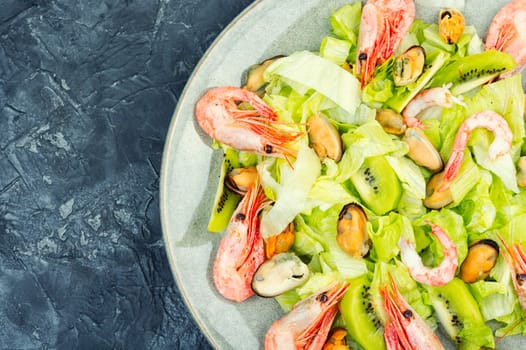 Homemade seafood salad with mussels and shrimps. Food background