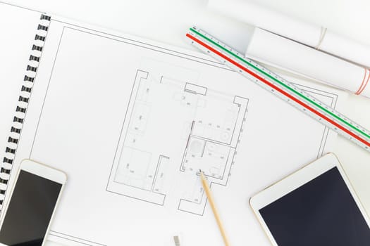 Creative flat lay overhead top view blueprints architectural flat project plan and office supplies on decorator white table workspace with swatches tools and equipment background copy space concept