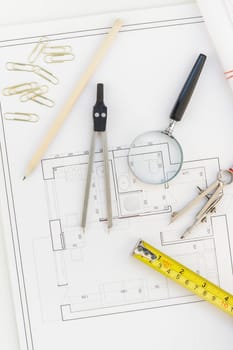 Creative flat lay overhead top view blueprints architectural flat project plan and office supplies on decorator white table workspace with swatches tools and equipment background copy space concept