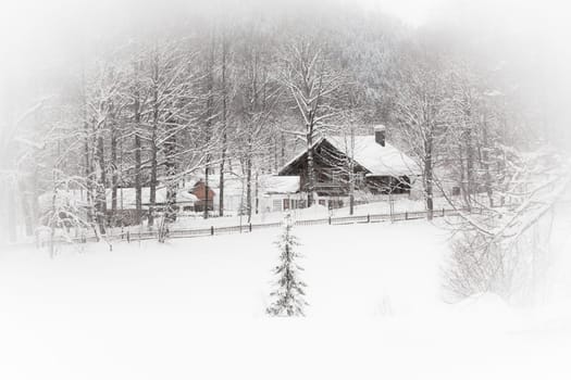 White landscape: snowy Alpine house in the woods. Toned and vignetted image as postcard
