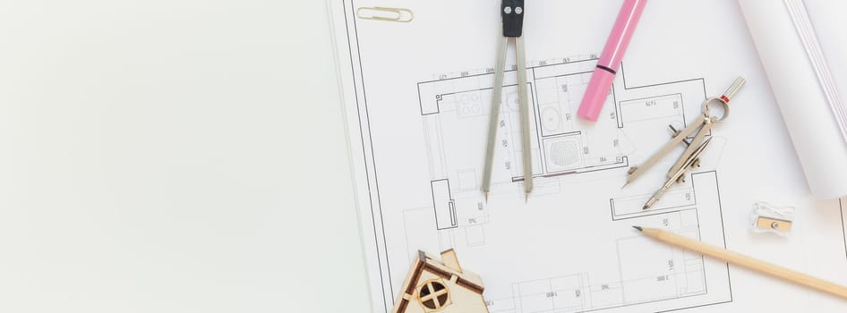 Creative flat lay long wide banner top view blueprints architectural flat project plan office supplies decorator white table workspace with swatches tools and equipment background copy space concept