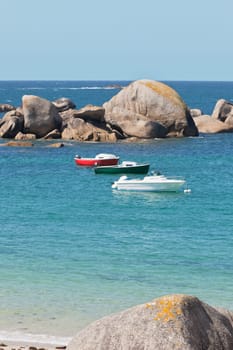 Turquoise sea and bright fisherman boats in Brittany