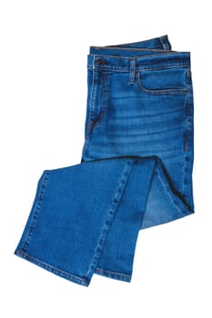 Jeans isolated. Folded trendy stylish blue denim stretch pants or trousers for men isolated on a white background. Clipping path. Jeans summer and autumn fashion.
