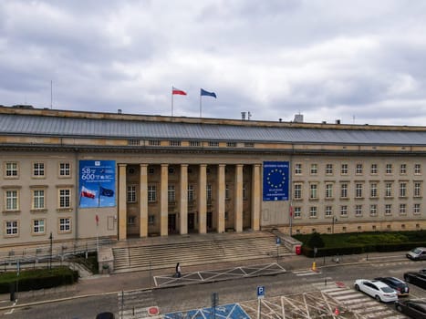 View of the provincial office building with Polish and European Union flags on the roof