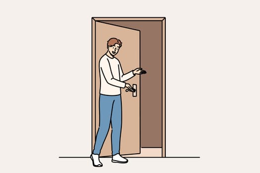 Man says welcome standing near door and shows inviting gesture when friends come to visit. Guy demonstrating welcome sign with palm, showing friendly and hospitable character traits