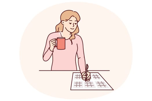 Woman solves sudoku puzzle and drinks hot tea enjoying math brain teasers. Young girl with sudoku puzzles on paper demonstrates high IQ, coping with mathematical examples with ease