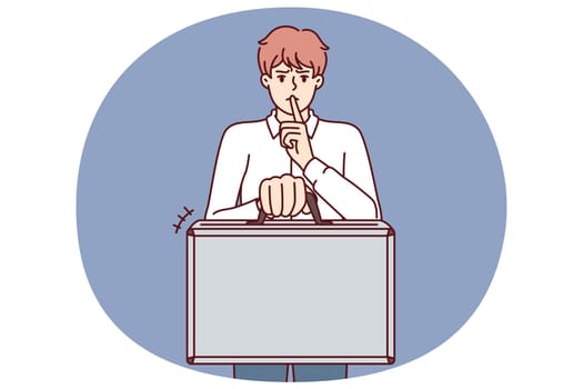 Business man holds suitcase and calls for silence without disclosing terms of contract and NDA rules for company employees. Concept of giving bribe or selling insider information for business purposes
