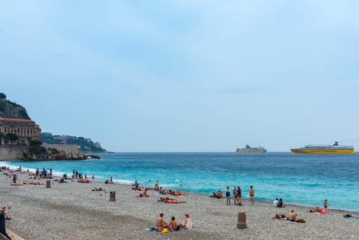 FRANCE, NICE - JUNE 13: people on the beach of the Mediterranean sea. Cote d Azur, Nice, France on June 13, 2015