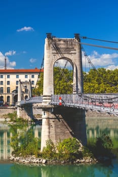 Old Passerelle du College bridge over Rhone river in Lyon, France. Summer day