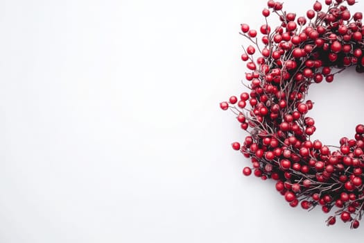 The vibrant red wreath, decorated with berries, stands out against a clean white background, evoking a cheerful holiday spirit perfect for seasonal decor in any setting.