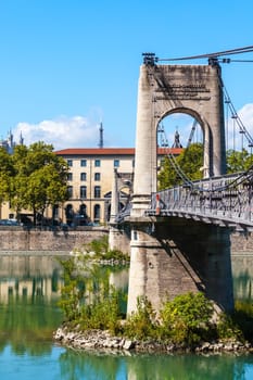 Old Passerelle du College bridge over Rhone river in Lyon, France. Summer day