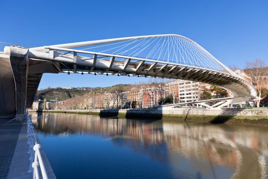 The Zubizuri, the Campo Volantin Footbridge in Bilbao, Spain, modern pedestrian tied arch crossing of the Nervion River by Santiago Calatrava architect