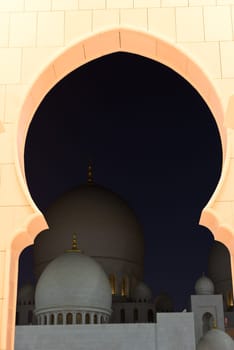 View of famous Sheikh Zayed White Mosque in Abu Dhabi, UAE at night