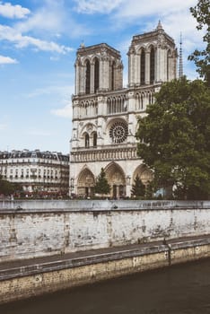 Cathedral of Notre Dame in Paris and the Seine river. Filtered image