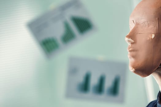 Businessman is wearing a mask, looking at financial charts in the background, representing the concepts of hypocrisy and deception in the corporate world