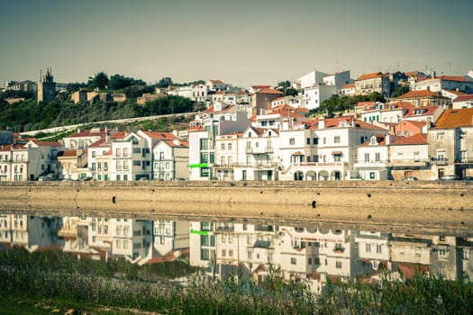 View of city Alcacer do Sal near the river Sado in Portugal. Horizontal filtered shot