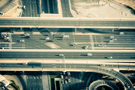 Top view of highway interchange in Dubai, UAE. Horizontal filtered shot