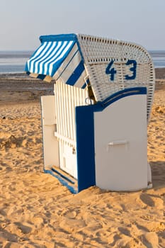 BeachÊwickerÊchair strandkorbÊin Northern Germany. North sea